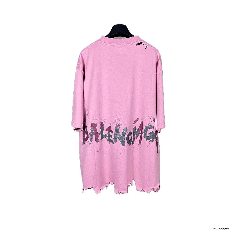Balenciaga's pink T-shirt with a hole and graffiti style