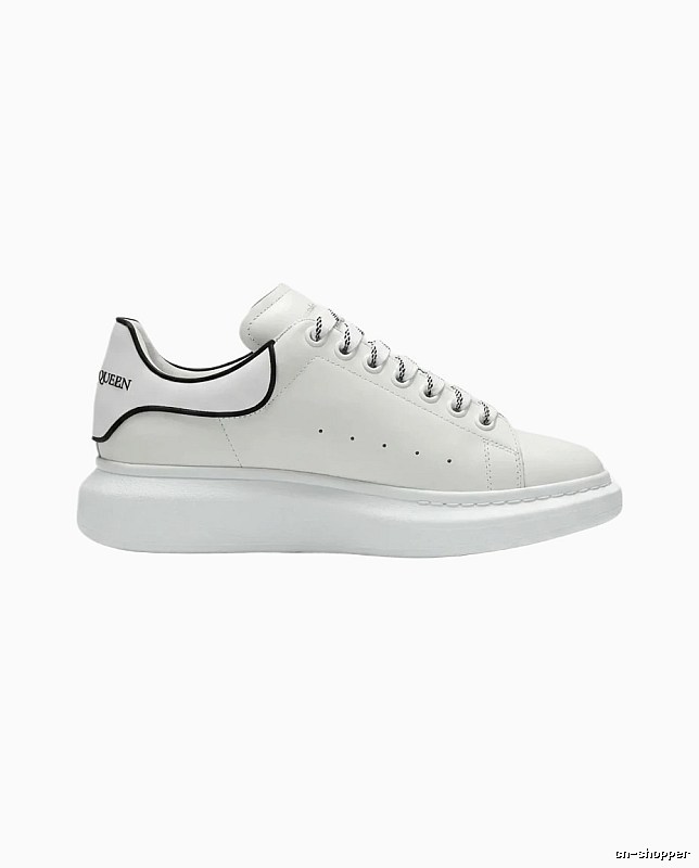 The minimalist style of McQueen white sneakers.